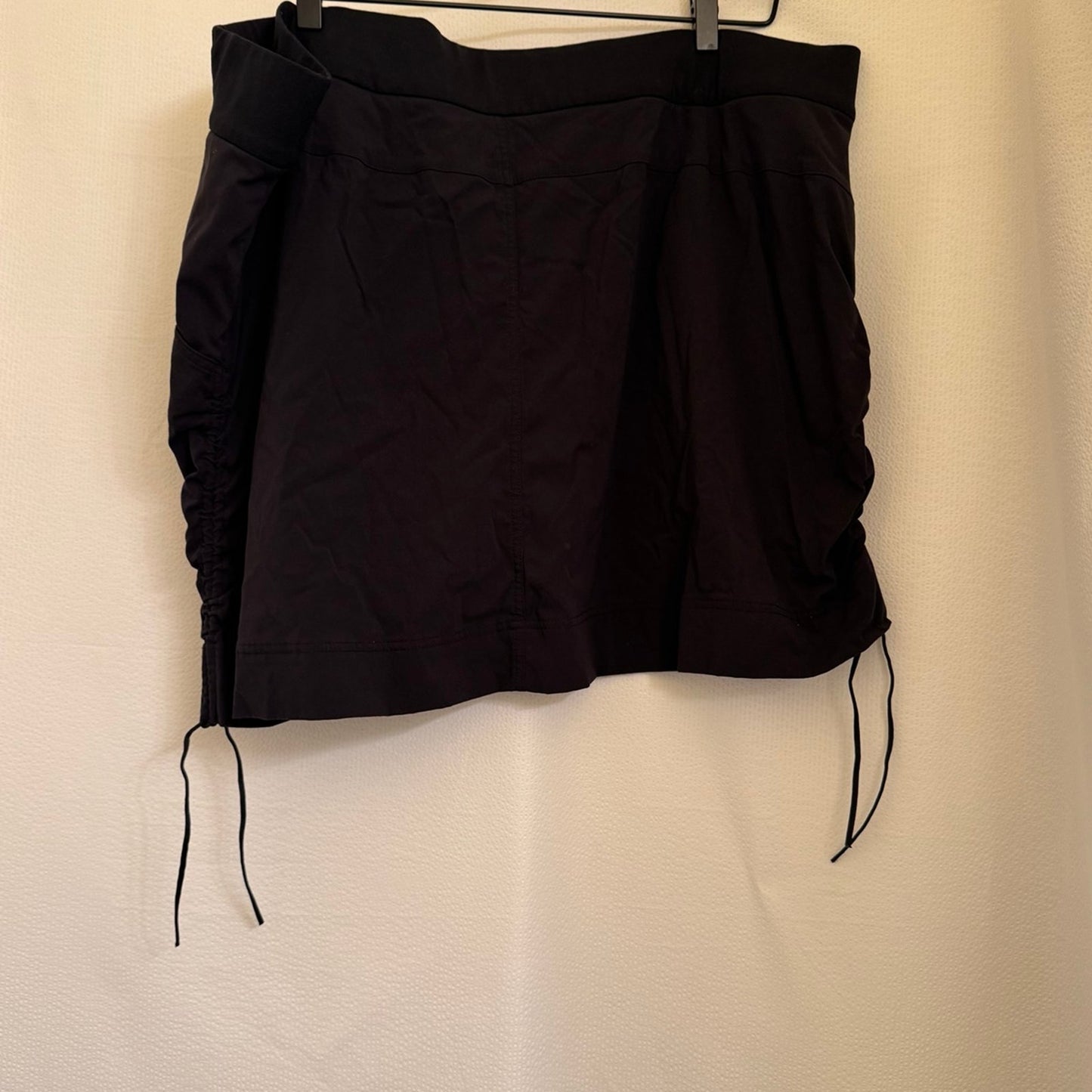 Black Columbia black skort with cinch pulls on both sides.